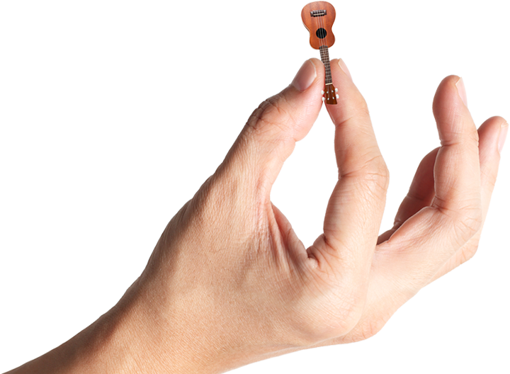 a very tiny ukelele in a gigantic hand