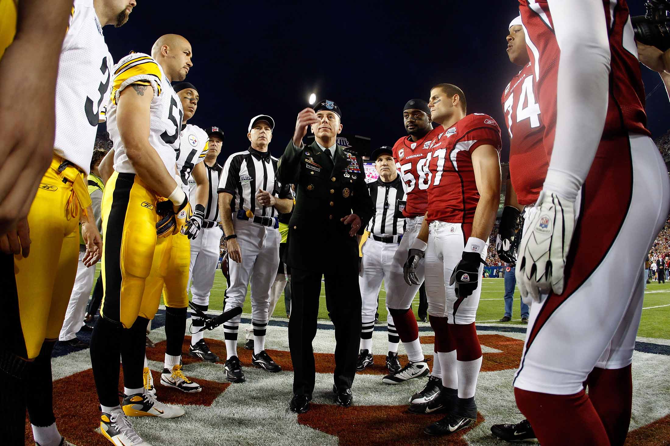 General David H. Petraeus, commander of the United States Central Command, performs the coin toss before Super Bowl XLIII