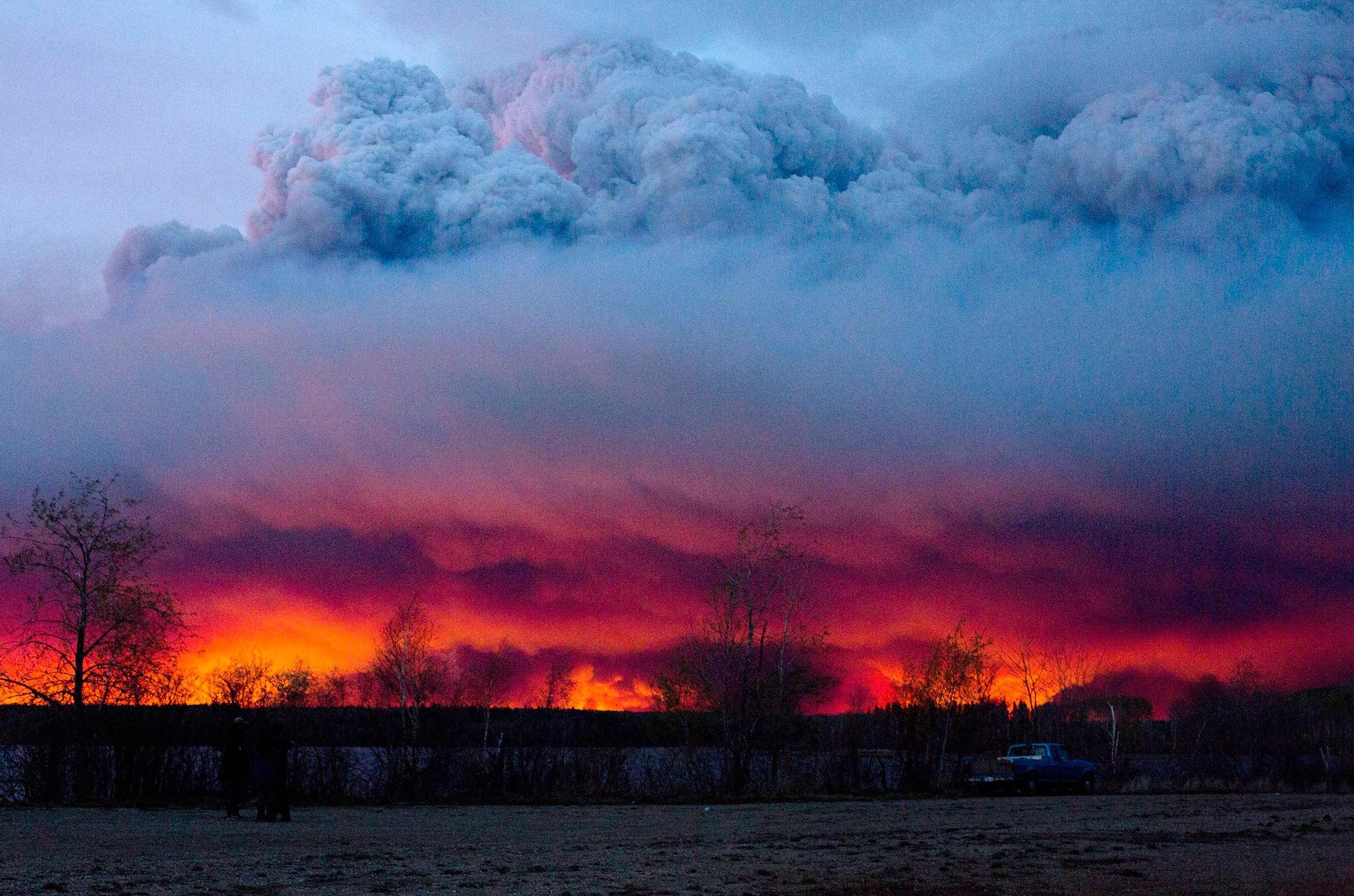 The wildfire moves toward the town of Anzac from Fort McMurray on May 4