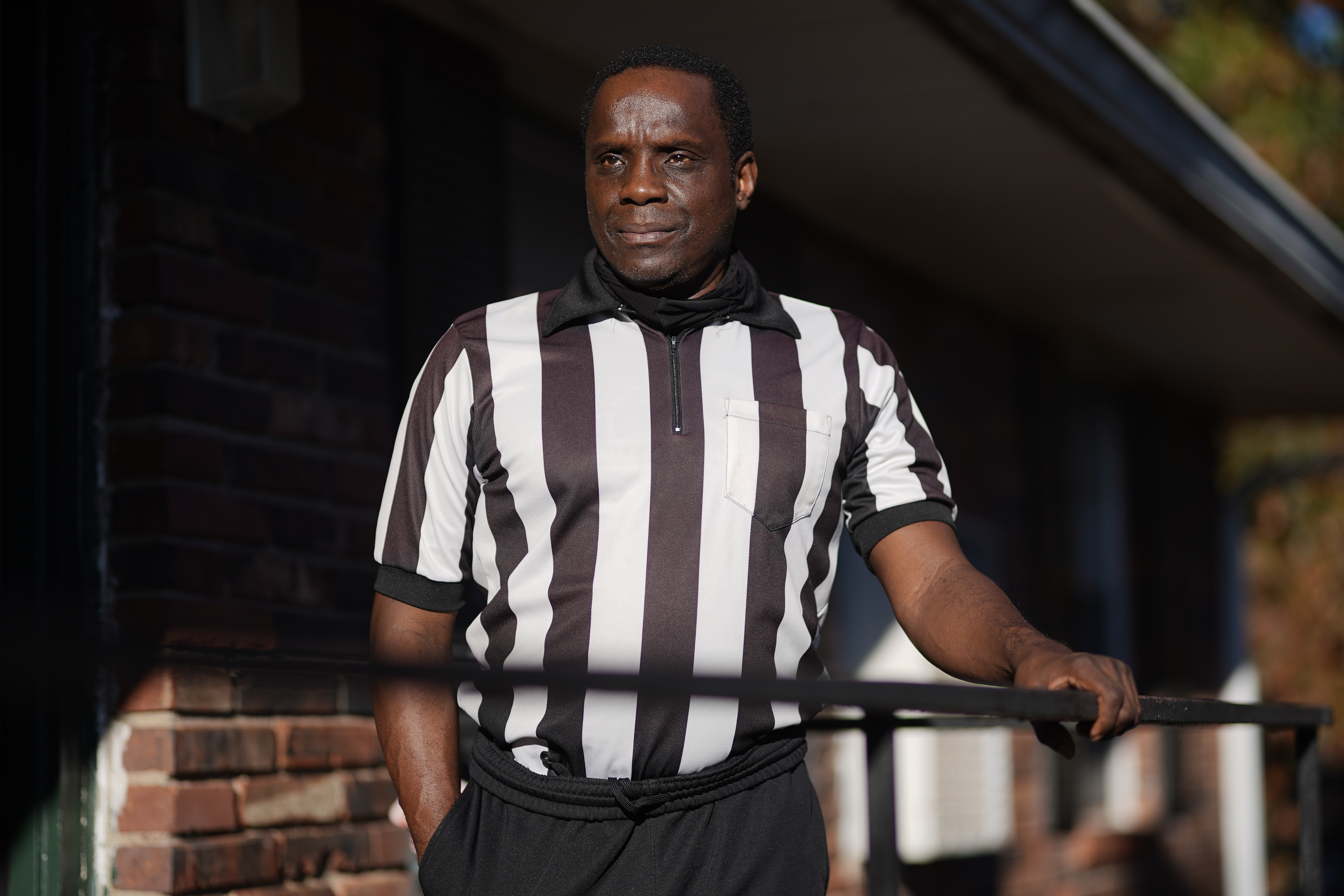 Kenny Grigsby, who referees high school and college basketball and football games, at his home in Atlanta.